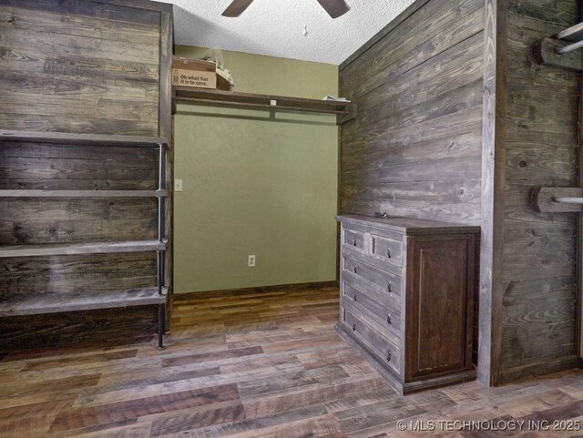 311 Washington Ave, Boswell, OK 74727 - walk in closet featuring a ceiling fan and wood finished floors