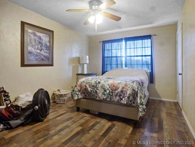 311 Washington Ave, Boswell, OK 74727 - bedroom featuring wood finished floors, a textured ceiling, and a ceiling fan