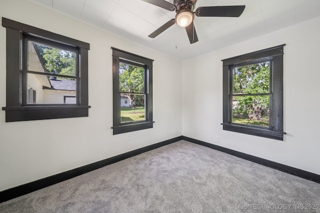 1119 W 7th St, Okmulgee, OK 74447 - unfurnished room with carpet and a ceiling fan