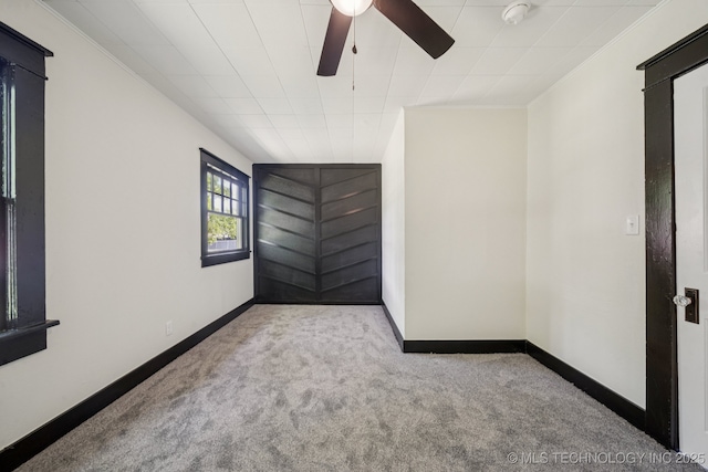 1119 W 7th St, Okmulgee, OK 74447 - carpeted empty room with a ceiling fan, a smoke detector, and ornamental molding