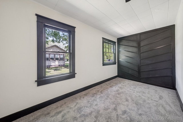 1119 W 7th St, Okmulgee, OK 74447 - carpeted empty room featuring healthy amount of natural light