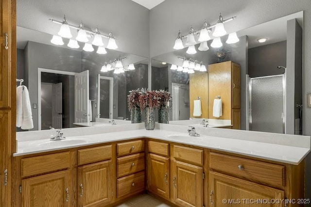 8306 E 77th Pl, Tulsa, OK 74133 - bathroom featuring a shower stall, double vanity, and tile patterned floors