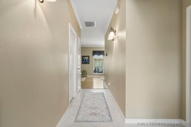 8306 E 77th Pl, Tulsa, OK 74133 - hall featuring crown molding and light tile patterned flooring