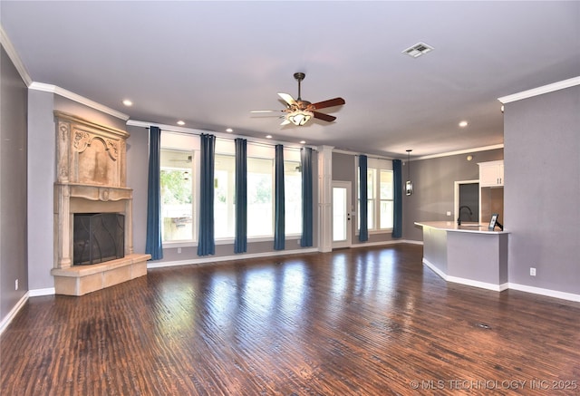 14772 S 212th E Ave, Coweta, OK 74429 - unfurnished living room featuring ornamental molding, ceiling fan, a fireplace, dark wood-style floors, and recessed lighting