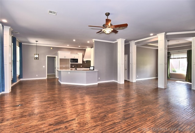 14772 S 212th E Ave, Coweta, OK 74429 - unfurnished living room with ornamental molding, a ceiling fan, recessed lighting, dark wood-type flooring, and ornate columns