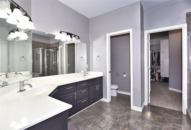 14772 S 212th E Ave, Coweta, OK 74429 - bathroom with a stall shower, double vanity, a chandelier, a walk in closet, and stone finish flooring