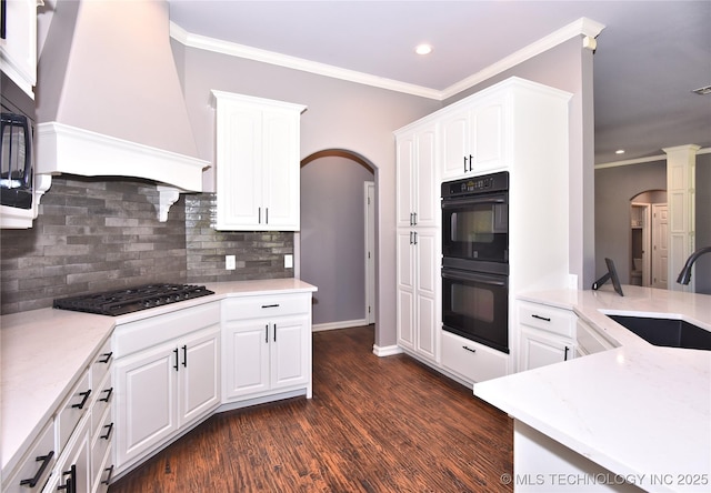 14772 S 212th E Ave, Coweta, OK 74429 - kitchen with black appliances, arched walkways, decorative backsplash, dark wood finished floors, and recessed lighting