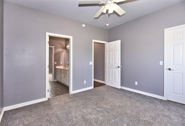 14772 S 212th E Ave, Coweta, OK 74429 - unfurnished bedroom with dark carpet, ensuite bath, and a ceiling fan