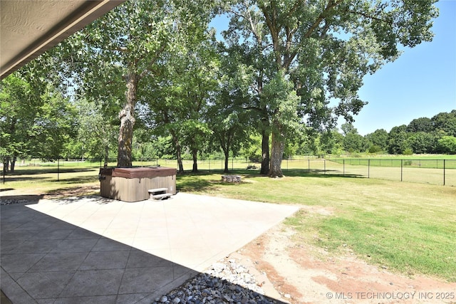14772 S 212th E Ave, Coweta, OK 74429 - fenced backyard with a hot tub, a patio, view of scattered trees, and a fire pit