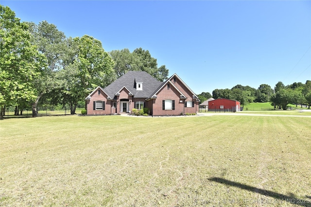 14772 S 212th E Ave, Coweta, OK 74429 - view of front of house featuring brick siding, a detached garage, a front yard, and roof with shingles