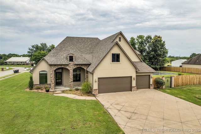 14651 S Gary Ave, Bixby, OK 74008 - french country inspired facade with stucco siding, stone siding, roof with shingles, driveway, and a porch