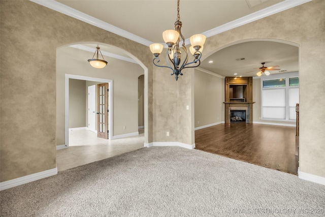 14651 S Gary Ave, Bixby, OK 74008 - unfurnished living room with arched walkways, ceiling fan, carpet floors, a fireplace, and ornamental molding