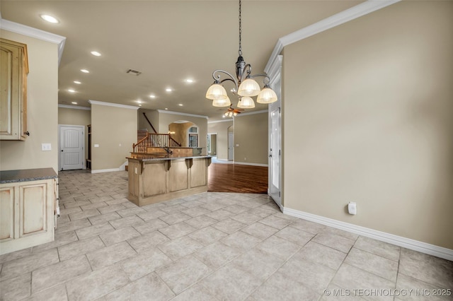 14651 S Gary Ave, Bixby, OK 74008 - kitchen with ornamental molding, recessed lighting, a kitchen breakfast bar, open floor plan, and a chandelier