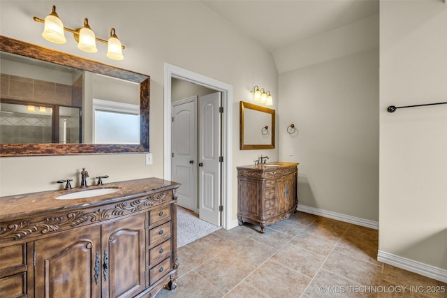 14651 S Gary Ave, Bixby, OK 74008 - bathroom with two vanities, a tile shower, and lofted ceiling
