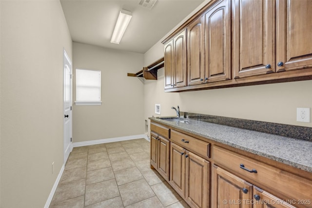 14651 S Gary Ave, Bixby, OK 74008 - laundry room featuring cabinet space, hookup for a washing machine, and light tile patterned flooring