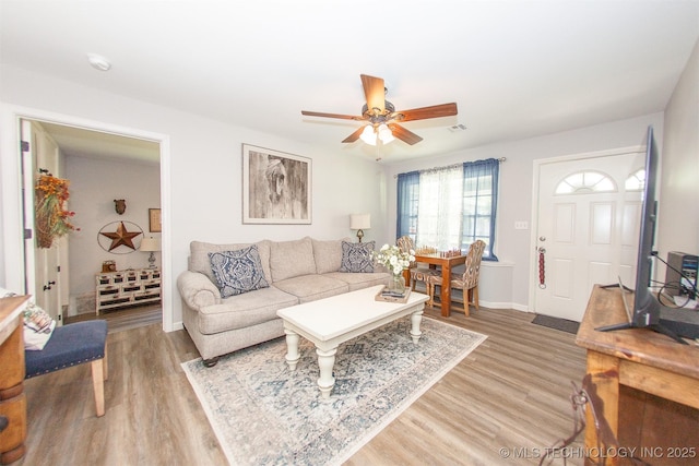 1119 N Oklahoma Ave, Claremore, OK 74017 - living room with light wood-style floors and a ceiling fan