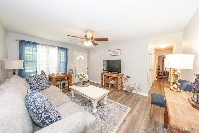 1119 N Oklahoma Ave, Claremore, OK 74017 - living area featuring light wood finished floors and ceiling fan