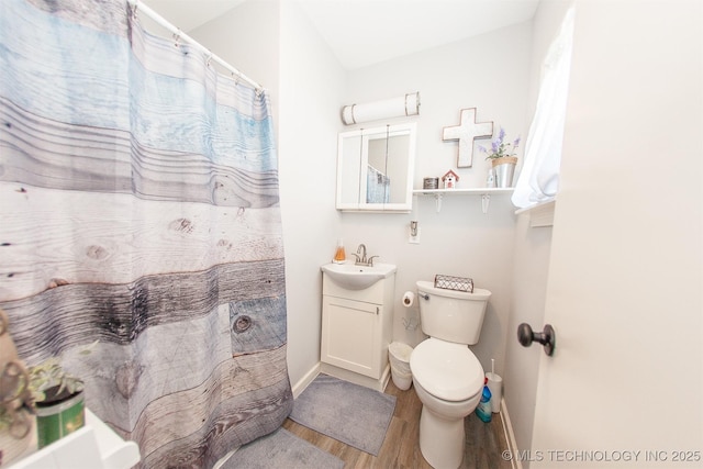 1119 N Oklahoma Ave, Claremore, OK 74017 - bathroom featuring wood finished floors, vanity, and curtained shower