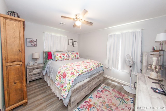 1119 N Oklahoma Ave, Claremore, OK 74017 - bedroom with light wood-style floors and a ceiling fan