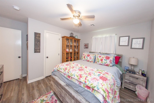 1119 N Oklahoma Ave, Claremore, OK 74017 - bedroom featuring wood finished floors and ceiling fan