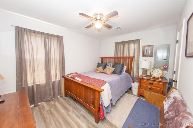 1119 N Oklahoma Ave, Claremore, OK 74017 - bedroom featuring wood finished floors and a ceiling fan