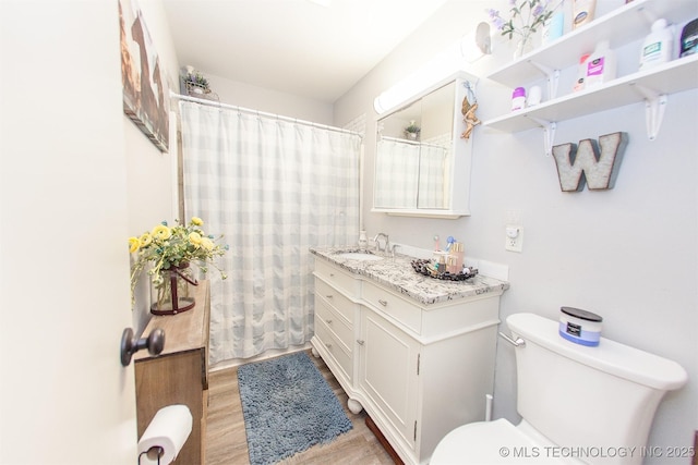 1119 N Oklahoma Ave, Claremore, OK 74017 - bathroom with vanity, wood finished floors, and a shower with curtain