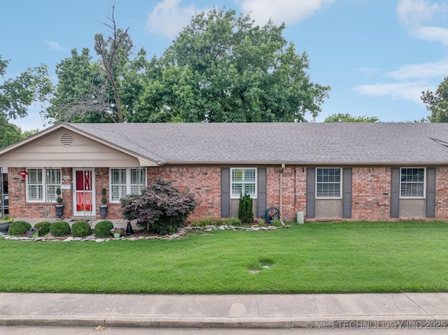 5612 S Newport Ave Unit 5612, Tulsa, OK 74105 - single story home with brick siding, a front lawn, and a shingled roof