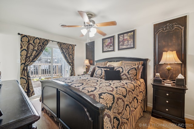 5612 S Newport Ave Unit 5612, Tulsa, OK 74105 - bedroom featuring access to exterior, wood finished floors, and a ceiling fan