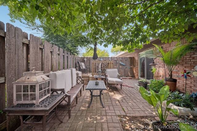 5612 S Newport Ave Unit 5612, Tulsa, OK 74105 - fenced backyard featuring a patio area and an outdoor hangout area