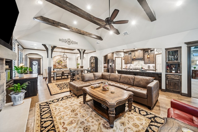 3818 W Phoenix Pl, Broken Arrow, OK 74011 - living room featuring arched walkways, beam ceiling, a ceiling fan, high vaulted ceiling, and light wood-style flooring