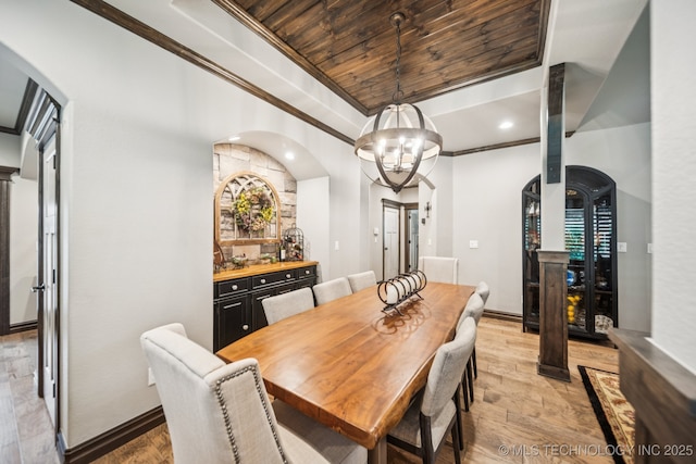 3818 W Phoenix Pl, Broken Arrow, OK 74011 - dining area with arched walkways, light wood-style floors, crown molding, a chandelier, and a tray ceiling