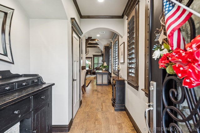 3818 W Phoenix Pl, Broken Arrow, OK 74011 - foyer featuring arched walkways, light wood finished floors, and ornamental molding