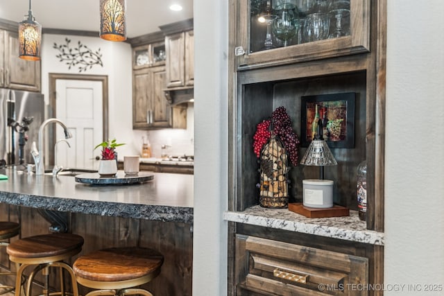 3818 W Phoenix Pl, Broken Arrow, OK 74011 - bar featuring freestanding refrigerator, decorative light fixtures, and recessed lighting