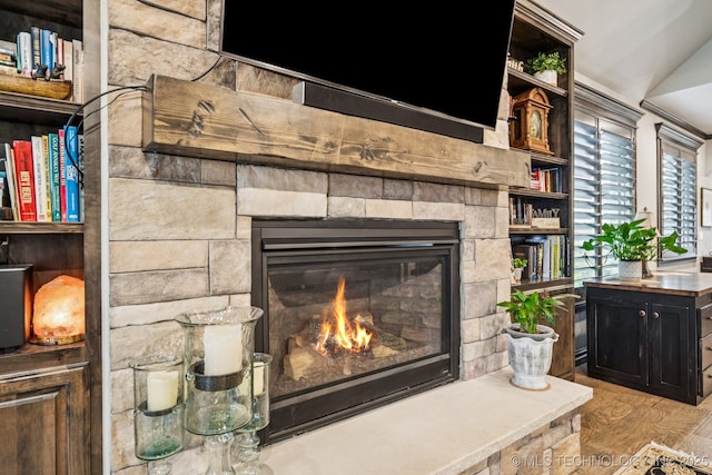 3818 W Phoenix Pl, Broken Arrow, OK 74011 - detailed view of a stone fireplace and wood finished floors