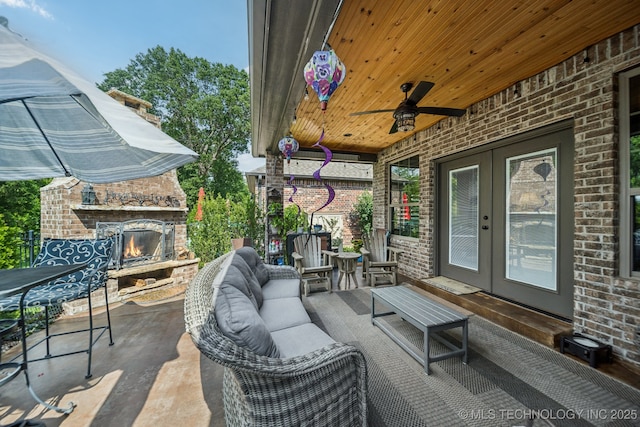 3818 W Phoenix Pl, Broken Arrow, OK 74011 - view of patio with french doors, ceiling fan, and an outdoor living space with a fireplace