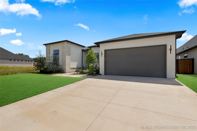 12005 S Vandalia Ave, Tulsa, OK 74137 - view of front of property with concrete driveway, a front lawn, an attached garage, and stucco siding