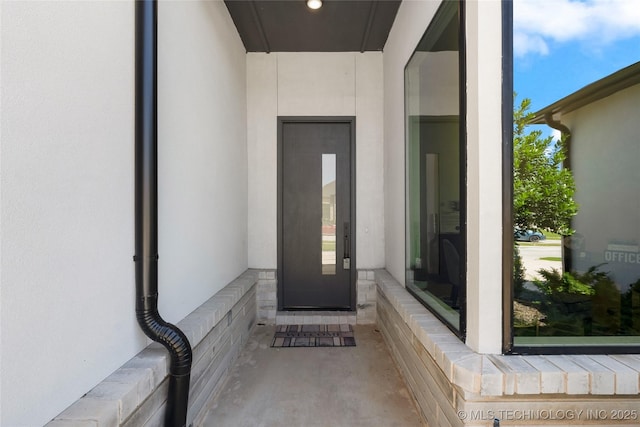 12005 S Vandalia Ave, Tulsa, OK 74137 - doorway to property featuring stucco siding