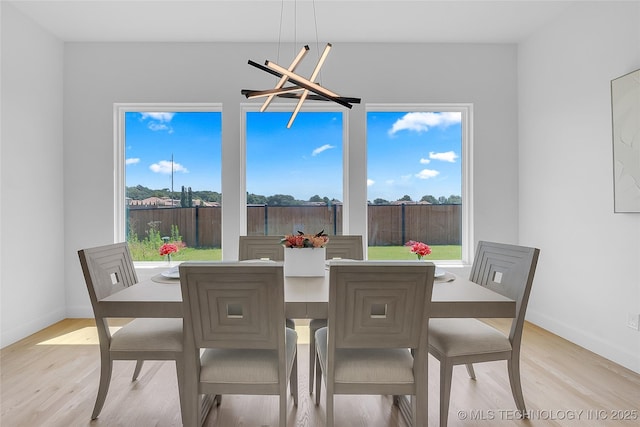 12005 S Vandalia Ave, Tulsa, OK 74137 - dining room with light wood finished floors and plenty of natural light
