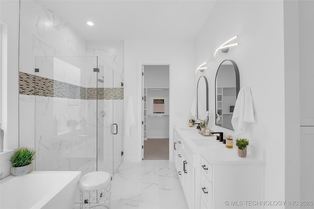 12005 S Vandalia Ave, Tulsa, OK 74137 - full bath with a marble finish shower, marble finish floors, a freestanding bath, double vanity, and recessed lighting