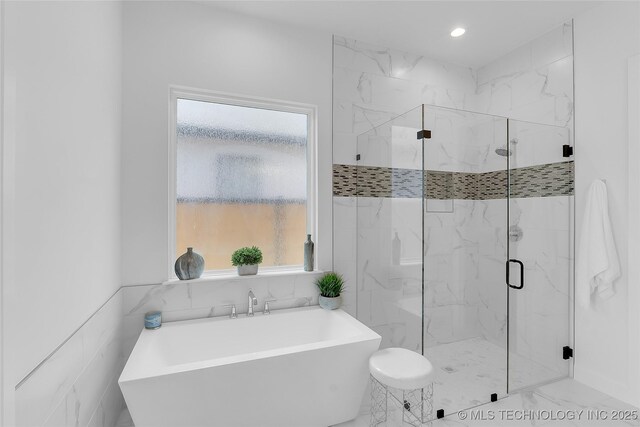 12005 S Vandalia Ave, Tulsa, OK 74137 - bathroom with a freestanding bath, a marble finish shower, and recessed lighting