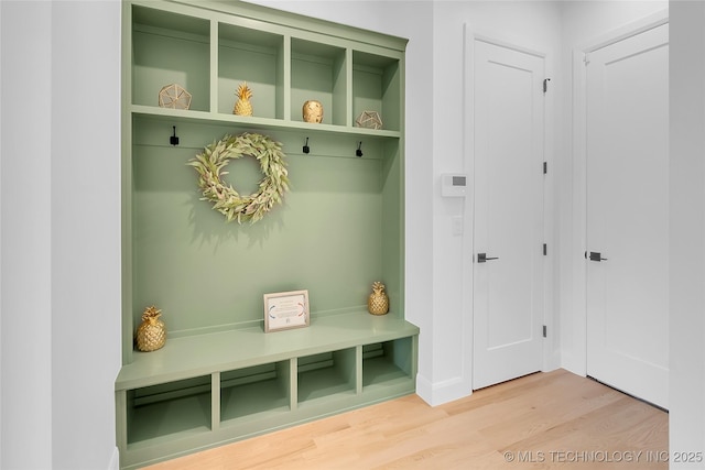12005 S Vandalia Ave, Tulsa, OK 74137 - mudroom featuring wood finished floors and baseboards