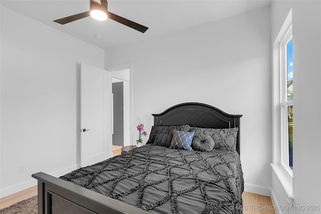 12005 S Vandalia Ave, Tulsa, OK 74137 - bedroom with light wood finished floors and ceiling fan