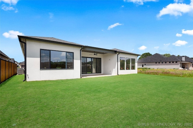 12005 S Vandalia Ave, Tulsa, OK 74137 - back of property with a ceiling fan, stucco siding, a yard, and a patio