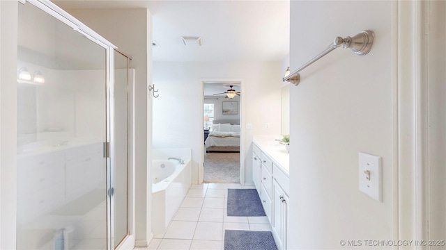 1010 W 120th St, Jenks, OK 74037 - full bathroom featuring a shower stall, ensuite bath, a garden tub, ceiling fan, and tile patterned floors