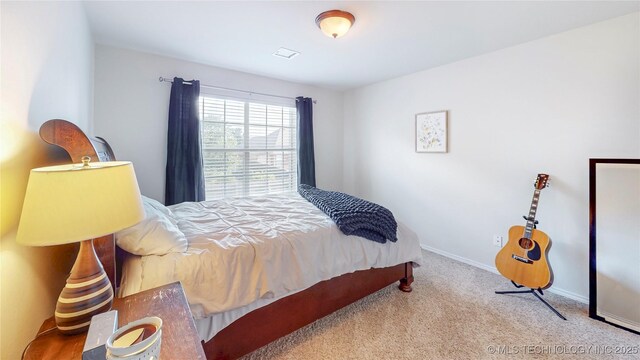 1010 W 120th St, Jenks, OK 74037 - carpeted bedroom featuring baseboards