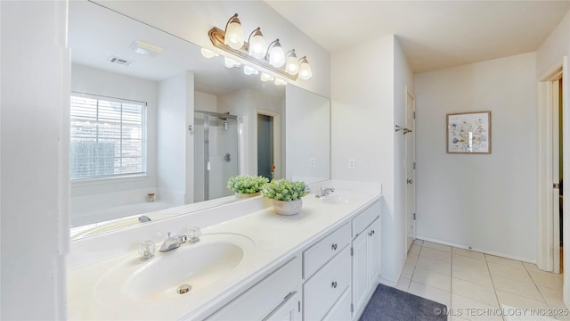 1010 W 120th St, Jenks, OK 74037 - full bath featuring double vanity, a shower stall, tile patterned floors, and a garden tub