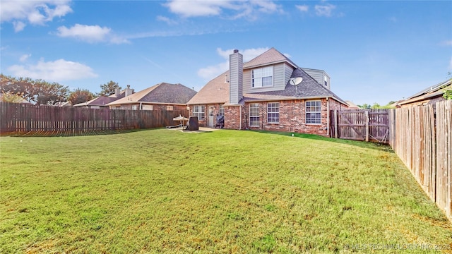 1010 W 120th St, Jenks, OK 74037 - rear view of house featuring brick siding, a fenced backyard, a chimney, and a shingled roof