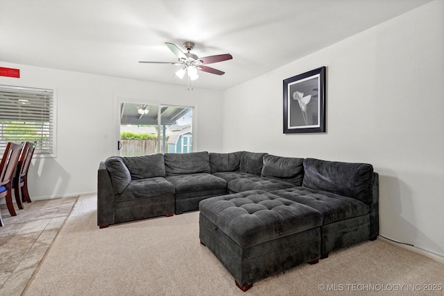 7547 E 27th St, Tulsa, OK 74129 - living area featuring healthy amount of natural light, ceiling fan, and light carpet