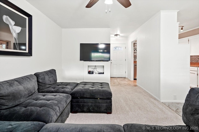 7547 E 27th St, Tulsa, OK 74129 - living area featuring a ceiling fan, light carpet, and ornamental molding
