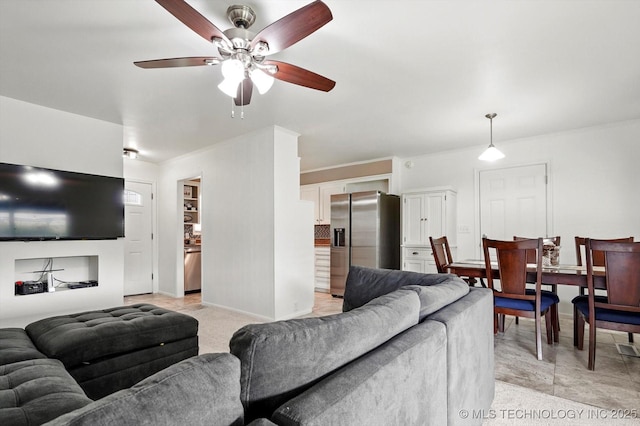 7547 E 27th St, Tulsa, OK 74129 - living area with a ceiling fan and ornamental molding
